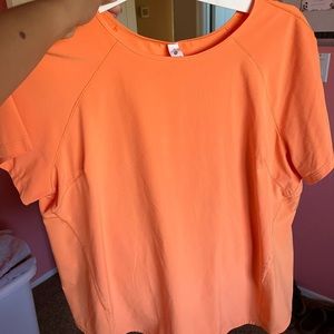 Orange lululemon workout tops a size 12